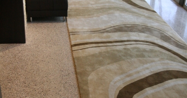 concrete with carpet flooring